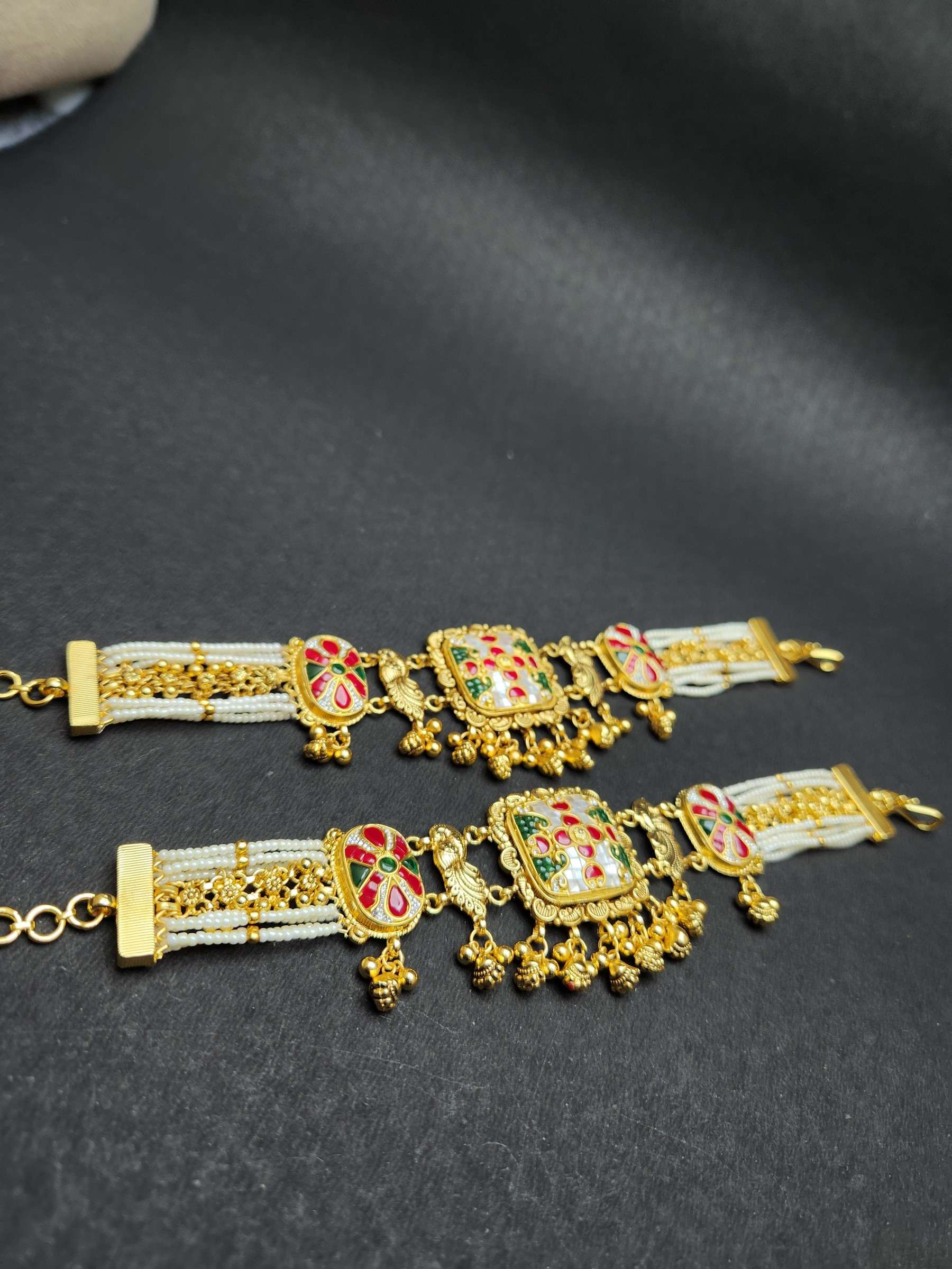 Pearl-bead strands woven with gold bead chains on a bracelet