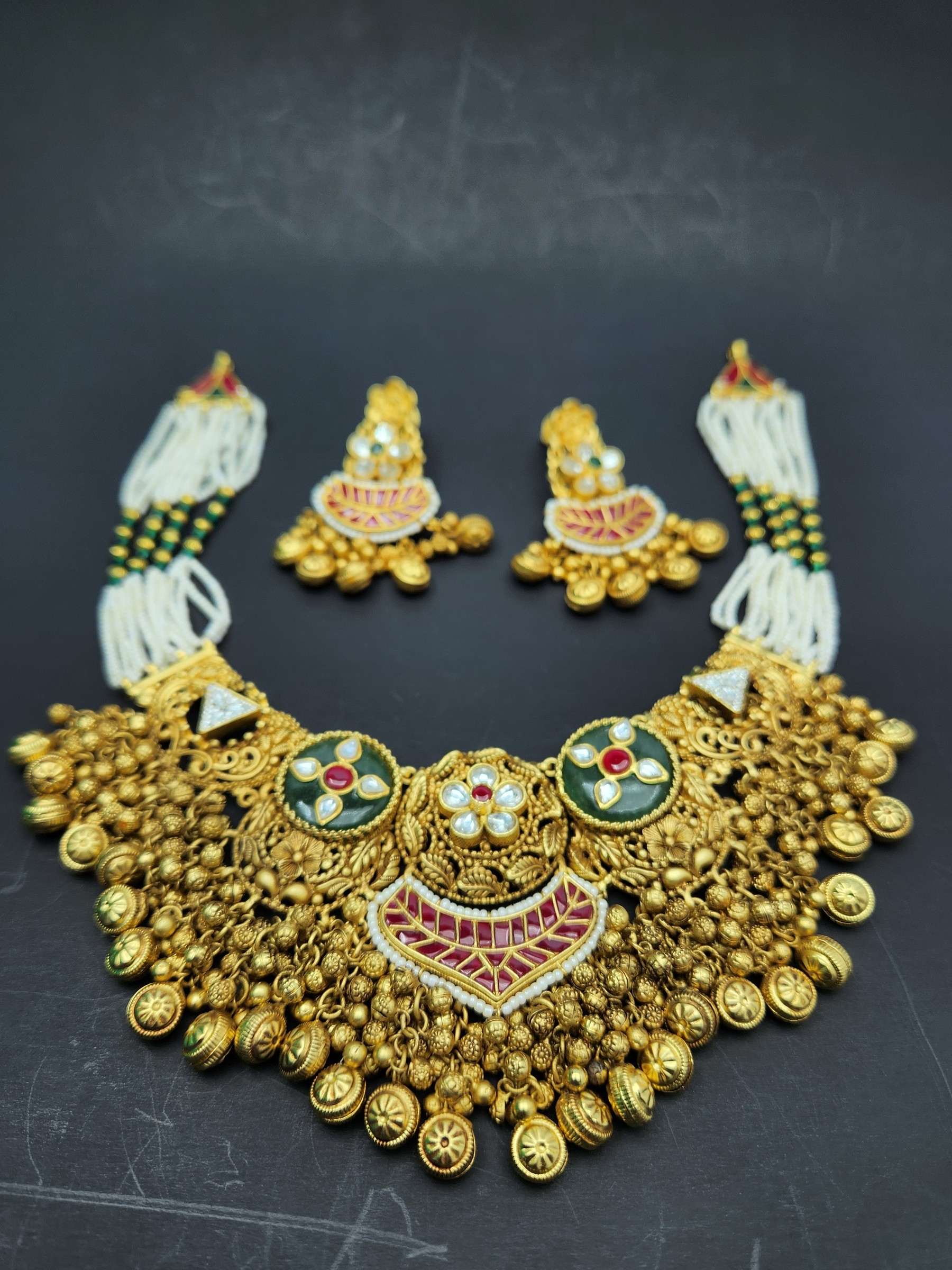 Matte gold bead clusters and bells on a bridal choker